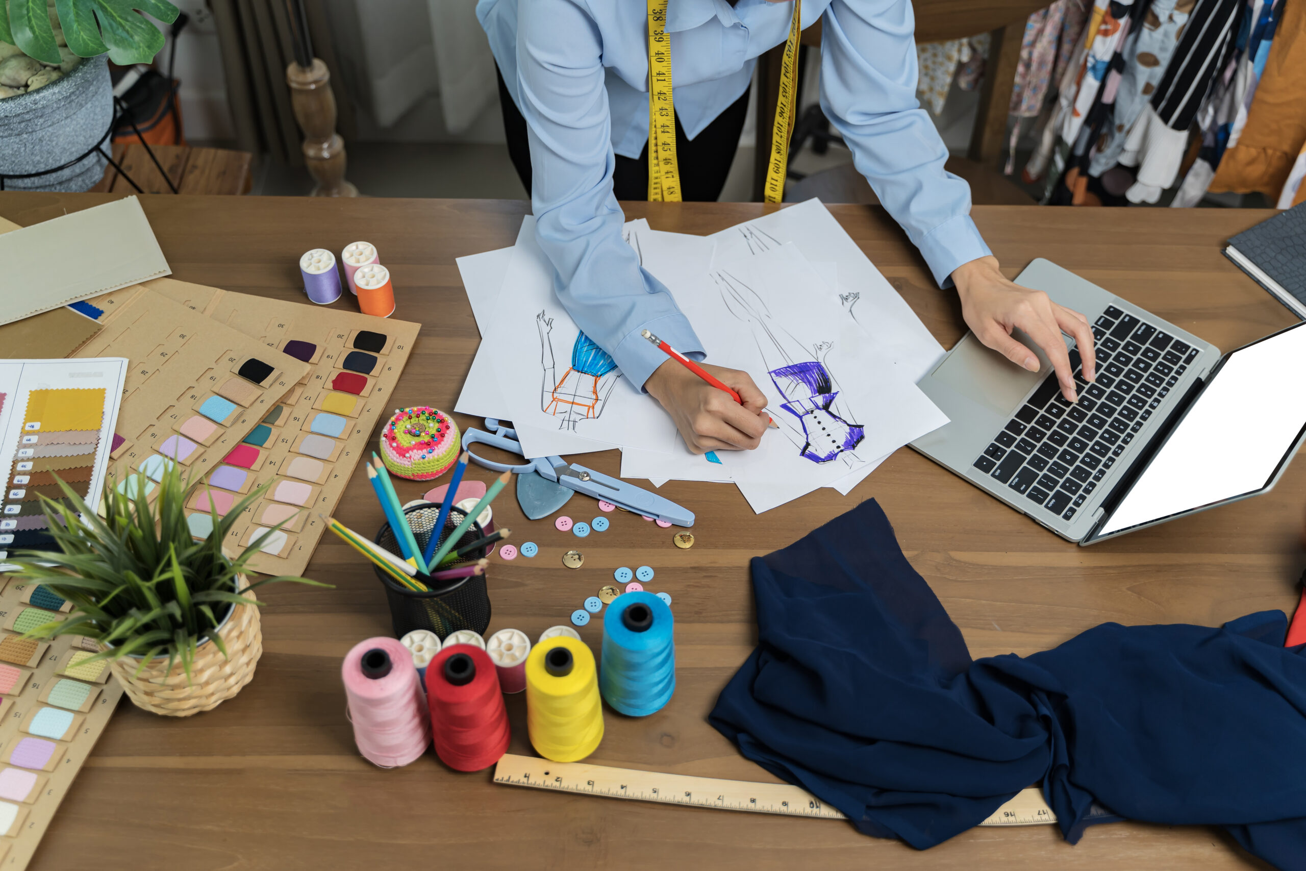 The tailor is working at his best.Professional designers are cut